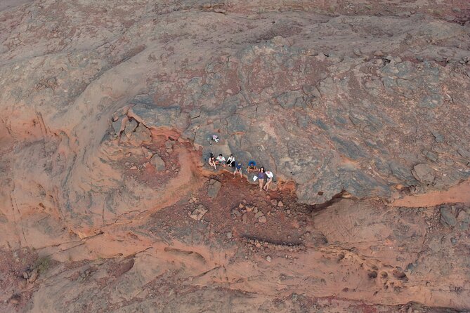 Full-Day Jeep Tour in Wadi Rum with Overnight Stay - Climbing dunes and reading the walls of Khazali Canyon