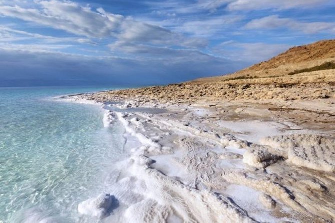 Private One Day Trip to Dead Sea with Lunch - The resort beach, pools, and changing rooms