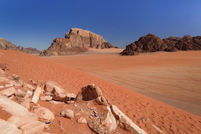 Wadi Rum: Explorer Jeep Tour PASS + Local Food + Optional Stay - Red Sand Dune and the fun of climbing